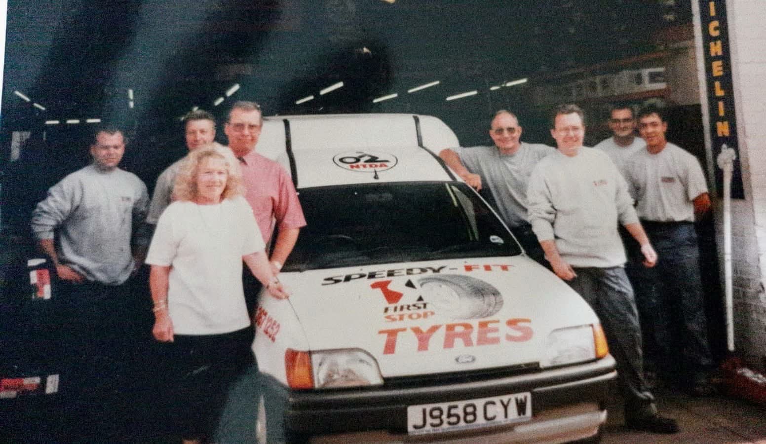 Speedy Fit team with the original branded van, 1990s